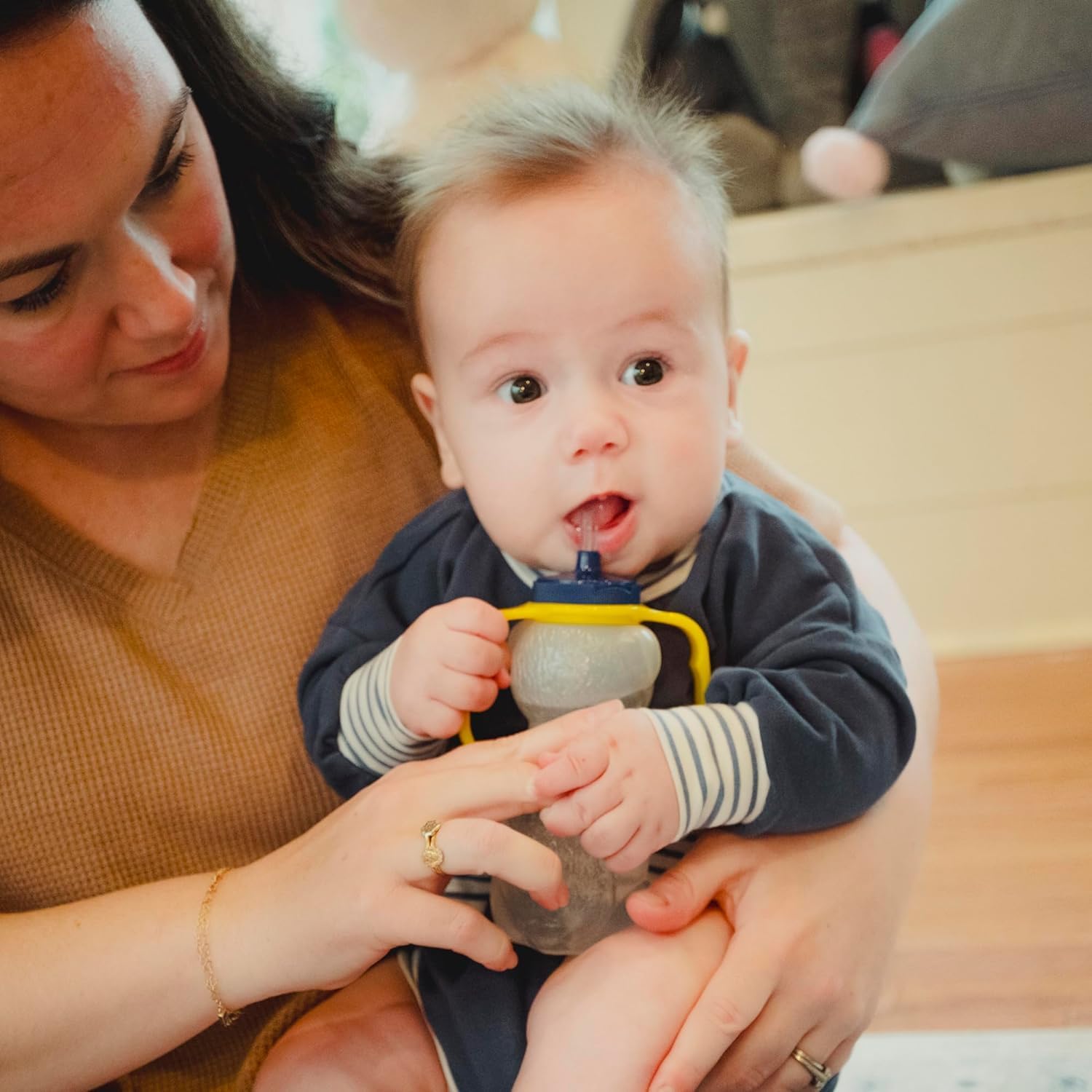 baby drinking from a cup